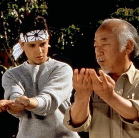 Mr. Miyagi shows Daniel some moves in a scene from The Karate Kid mr miyagi shows daniel some moves in a scene from the karate kid