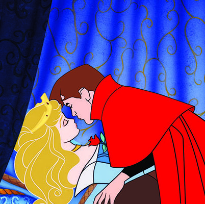 the prince leans in to give a kiss to an enchanted princess aurora in a scene from sleeping beauty