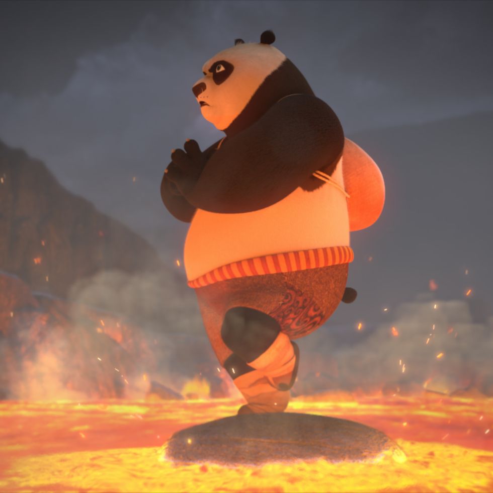 po stands on a rock surrounded by lava in a scene from kung fu panda the dragon knight, a good housekeeping pick for best kids tv shows