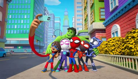 spidey and his superhero pals pose for a selfie in a scene from spidey and his amazing friends the show is a good housekeeping pick for best kids tv shows