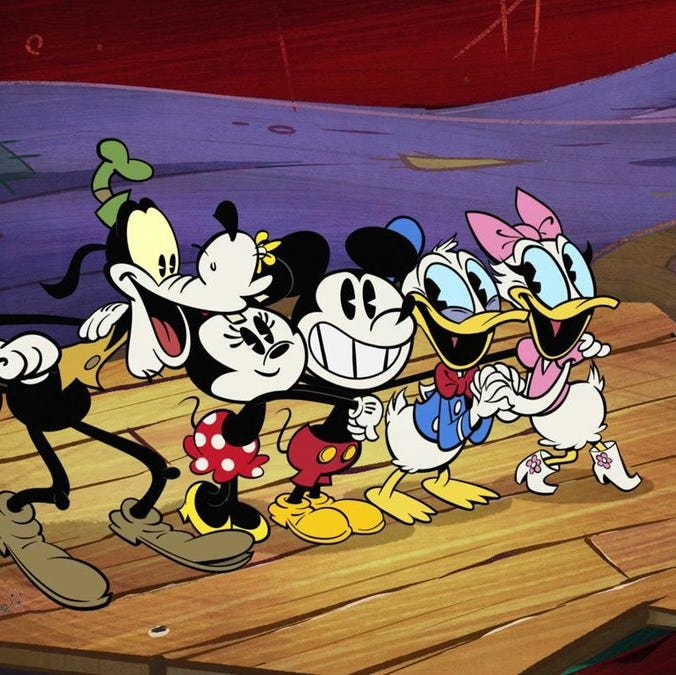 goofy, minnie, mickey, donald and daisy stand on a pier in a scene from the wonderful world of mickey mouse the show is a good housekeeping pick for best kids tv shows