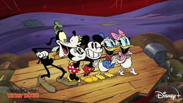 goofy, minnie, mickey, donald and daisy stand on a pier in a scene from the wonderful world of mickey mouse the show is a good housekeeping pick for best kids tv shows