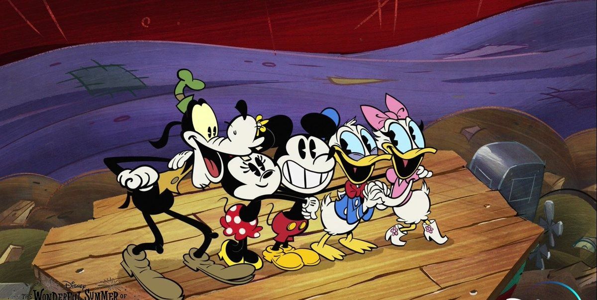 goofy, minnie, mickey, donald and daisy stand on a pier in a scene from the wonderful world of mickey mouse the show is a good housekeeping pick for best kids tv shows
