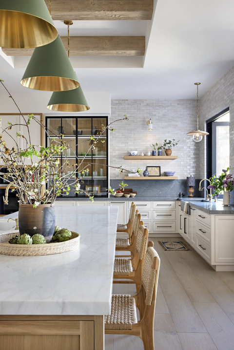 kitchen with green and gold pendants in triangle cone shape