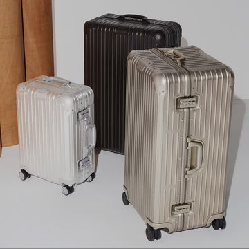 a few suitcases sit on the floor