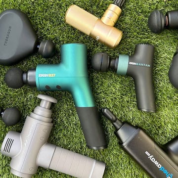a selection of massage guns on astro turf a selection of massage guns on astro turf