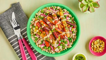 a grain bowl with carrots on a green background from green chef, a good housekeeping pick for best meal delivery service