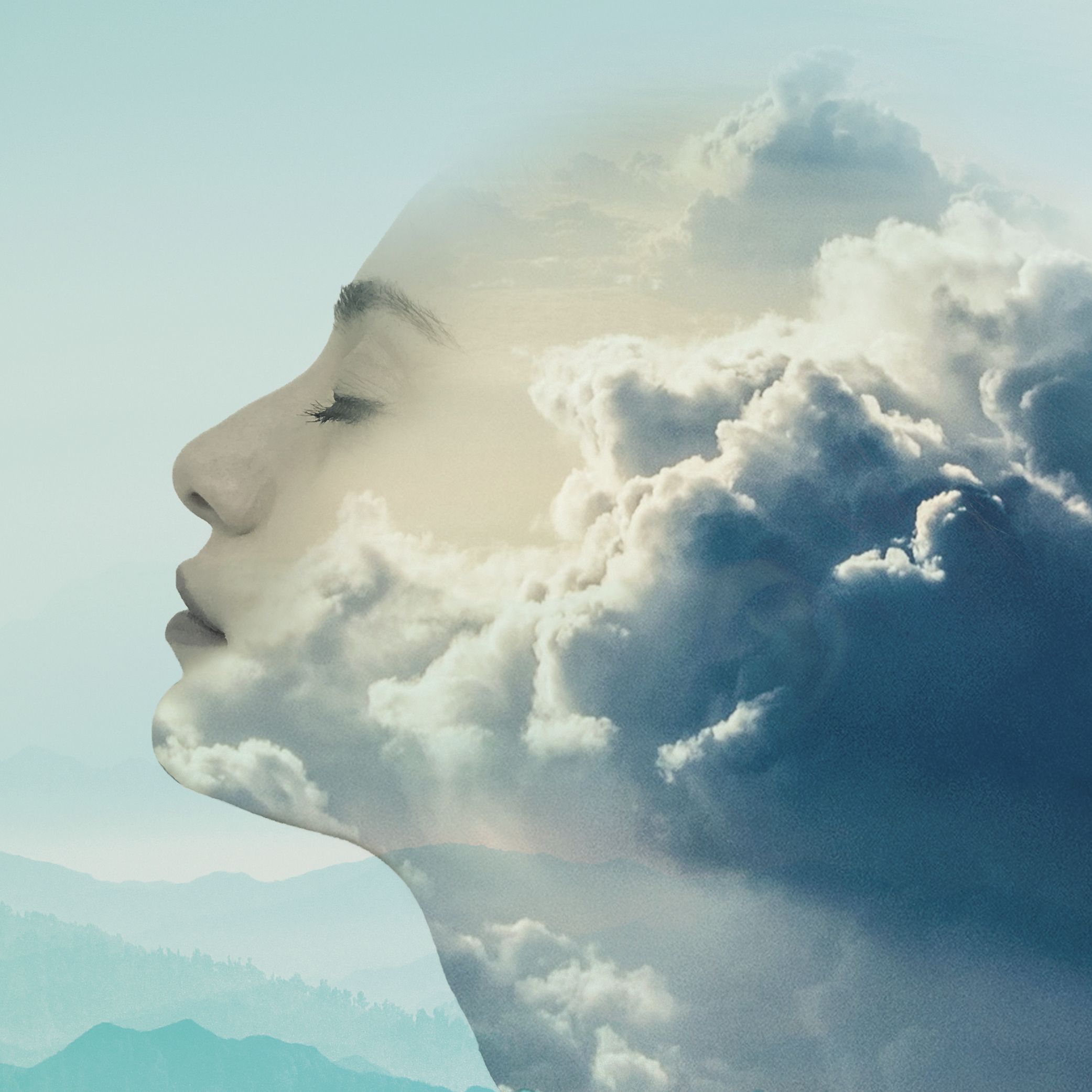 woman's face merging with clouds