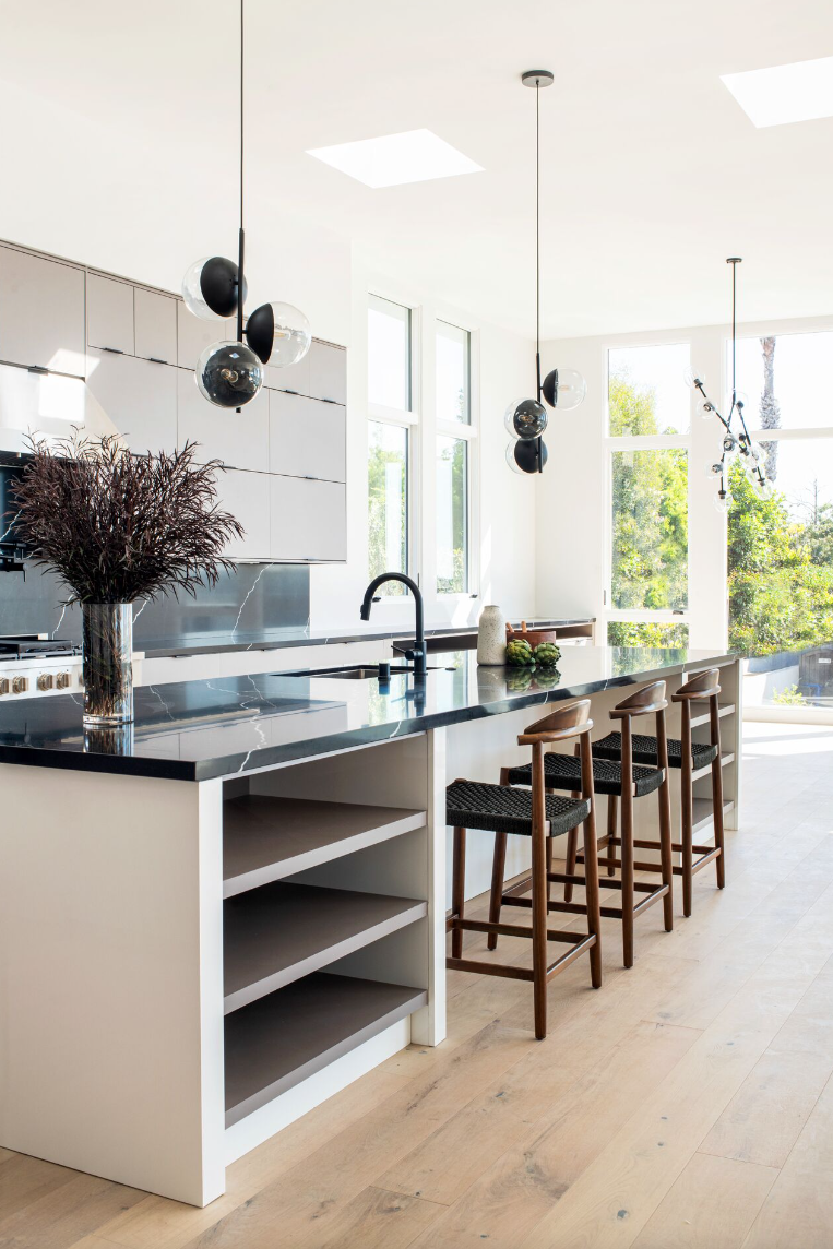 kitchen with big windows and black counters