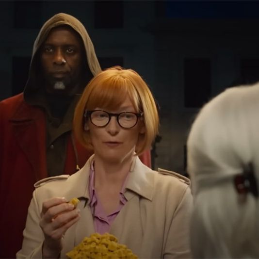 idris elba, playing a djinn, stands behind a woman played by tilda swinton in a scene from "three thousand years of longing," a good housekeeping pick for best movies of 2022