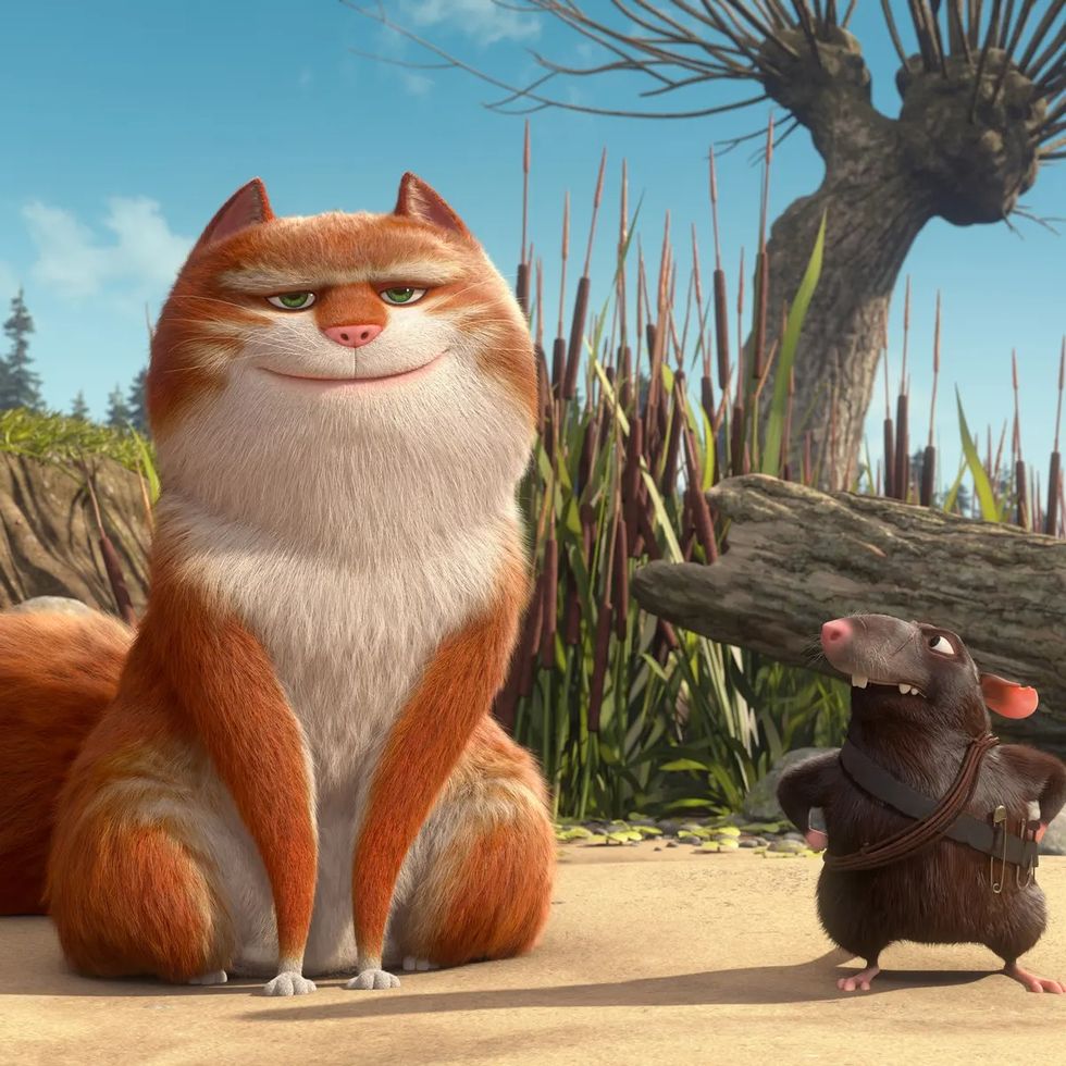 a cat talks to a rat in a scene from the amazing maurice, a good housekeeping pick for best kids' movies 2023