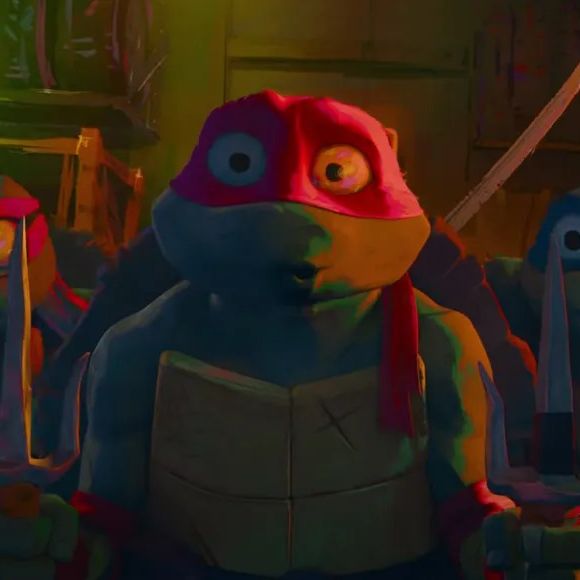 the ninja turtles look frightened in a scene from teenage mutant ninja turtles mutant mayhem, a good housekeeping pick for best kids' movies 2023