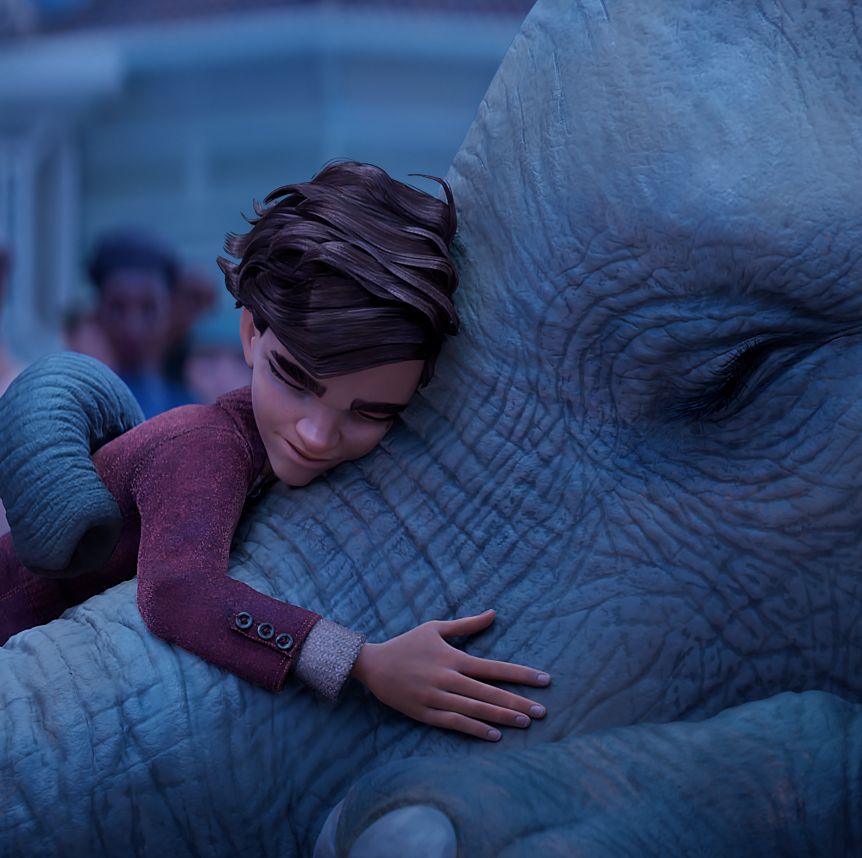 peter hugs an elephant in a scene from the magician's elephant, a good housekeeping pick for best kids movies 2023