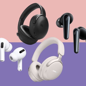 Best noise cancelling headphones different styles of wireless headphones and earbuds positioned on a twotone background