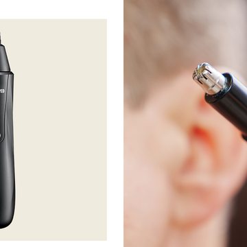 a person holding a nose hair trimmer