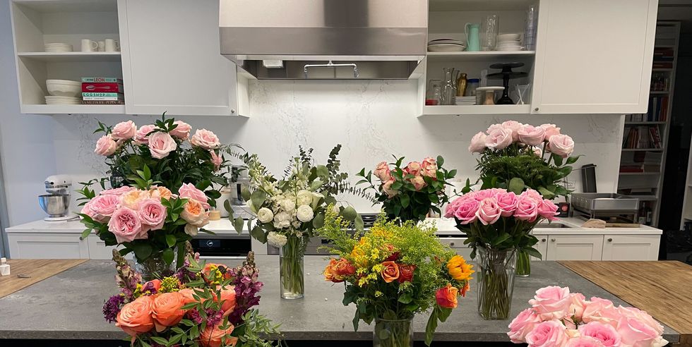 multiple sets of flowers in kitchen to show flower testing at good housekeeping
