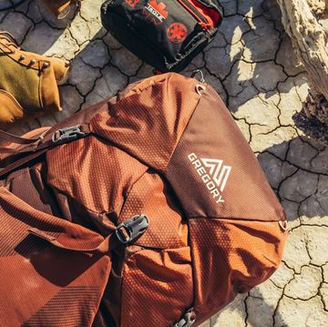 Gregory outdoor backpack with hiking shoes and first aid kit