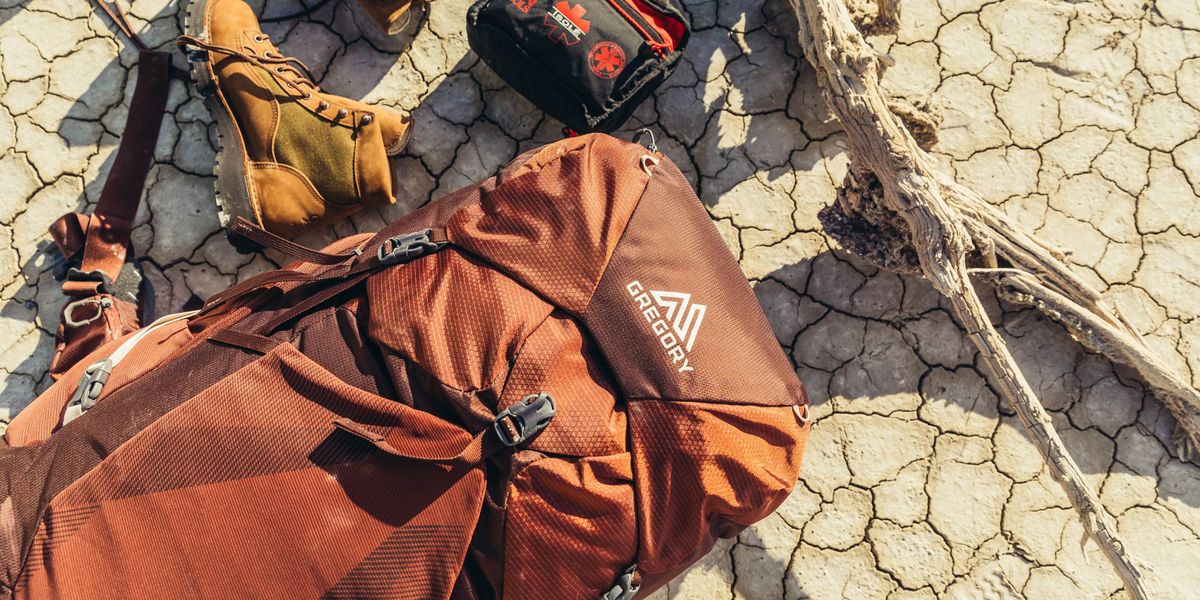Gregory outdoor backpack with hiking shoes and first aid kit