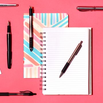 assortment of pens and notebooks