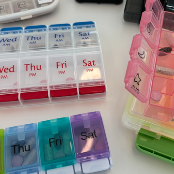 The Best Pill Organizers several pill organizers on a tabletop