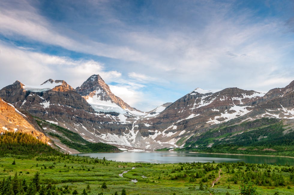 scenic view of mt assiniboine a pyramidal peak mountain aka canadian matterhorn with lake magog and surrounding canadian rockies, mount assiniboine provincial park, border of british columbia alberta, canada