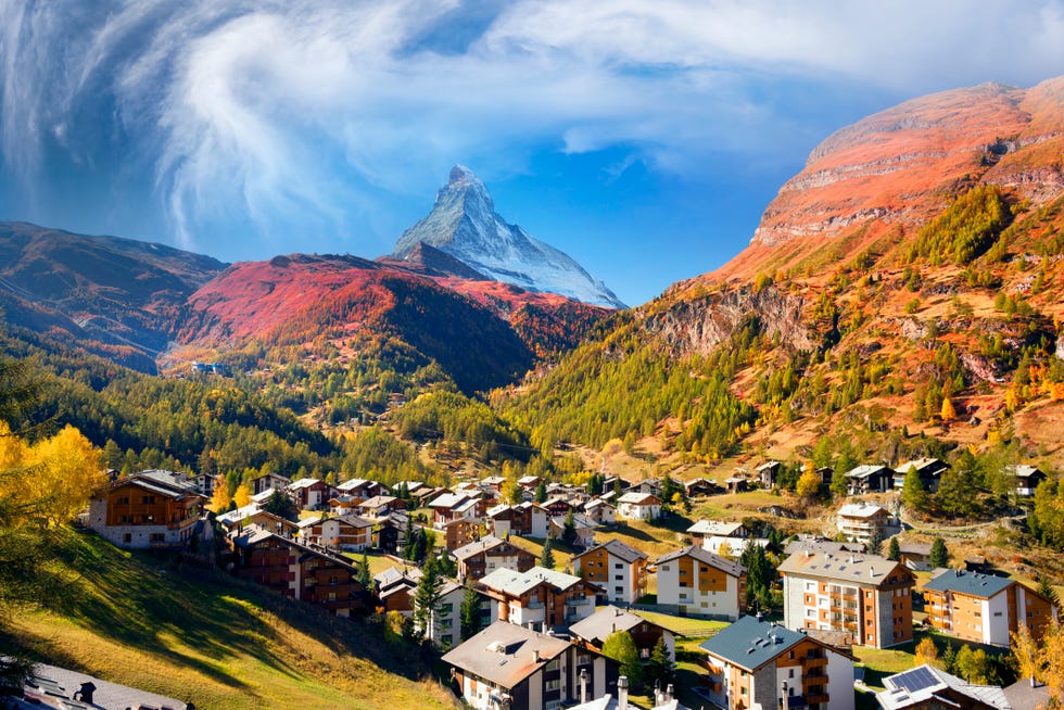 autumn resort slopes and bright beautiful landscape with the famous matterhorn peak in autumn in switzerland original beautiful houses of the swiss highlanders on a moonlit night