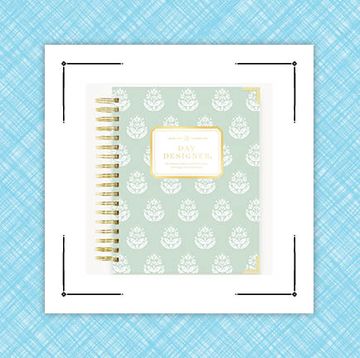 day designer and anthropologie planners on blue background