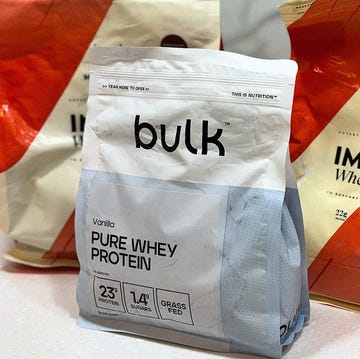 four different bags of protein powder on a kitchen surface four different bags of protein powder on a kitchen surface