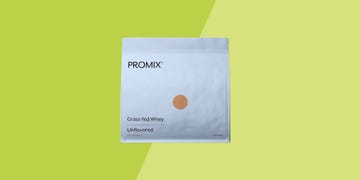 bag of promix protein powder on a green background