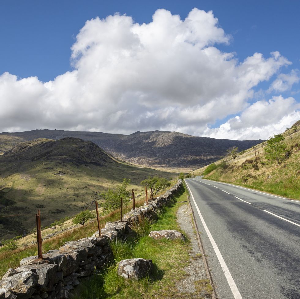 the a498 heading up from nantgwynant to pen y pass on a sunny spring day a popular tourist route with stunning scenery in snowdonia, north wales