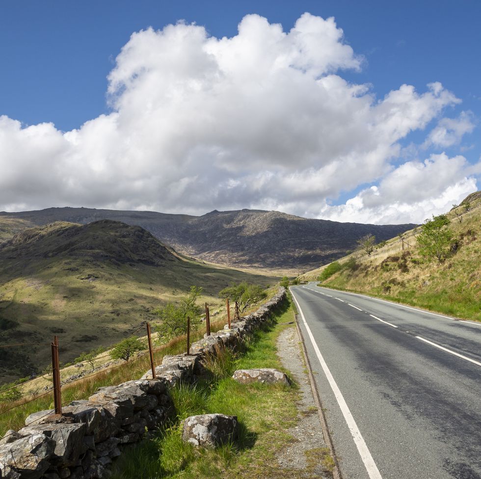 the a498 heading up from nantgwynant to pen y pass on a sunny spring day a popular tourist route with stunning scenery in snowdonia, north wales