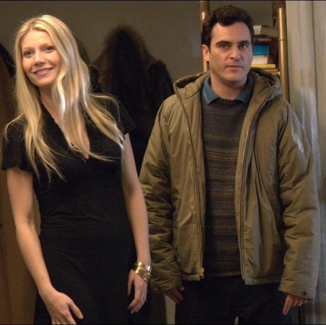 a man and woman awkwardly enter an apartment in a scene from two lovers