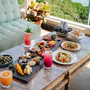 a bunch of food on a table, overlooking austin