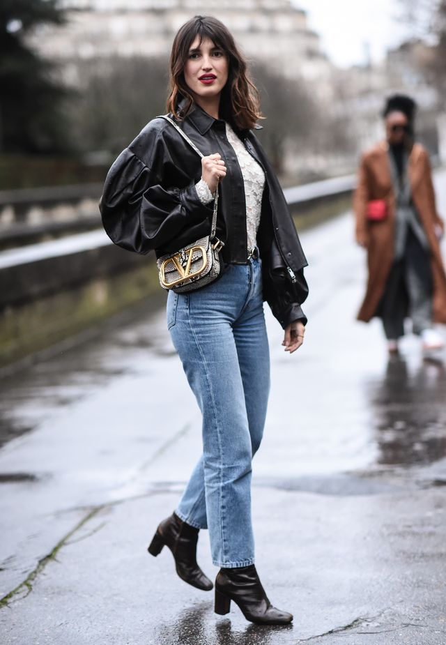 paris, france   march 01 jeanne damas is seen wearing a black leather jacket, blue jeans, black boots and valentino bag outside the valentino show during paris fashion week aw20 on march 01, 2020 in paris, france photo by daniel zuchnikgetty images