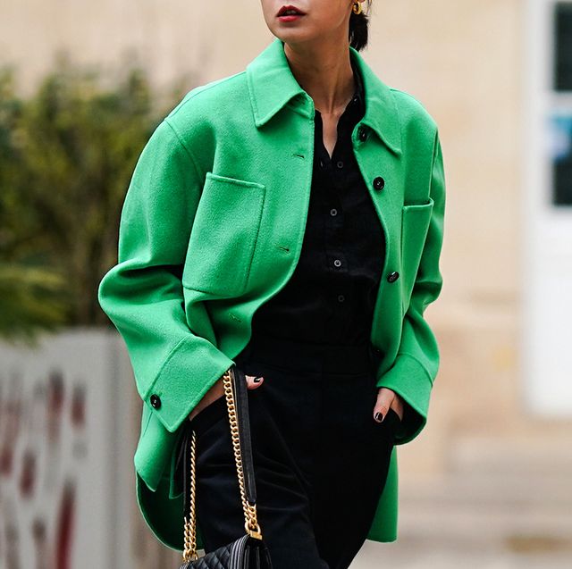 a person wearing a green jacket