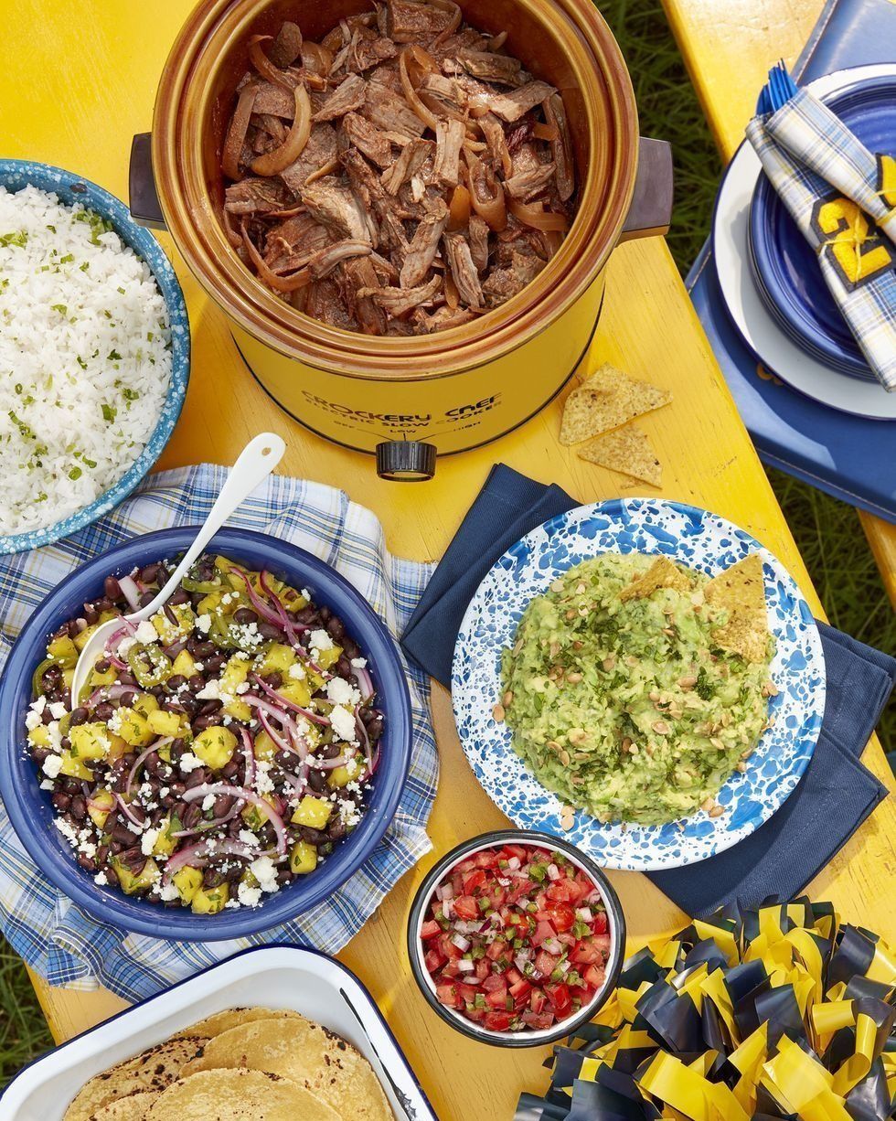 slow cooker smoky beef tacos served with corn tortillas and pica de gallo and guacamole