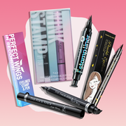 an assortment of eyeliner stamp pens grouped together over a pink gradient background