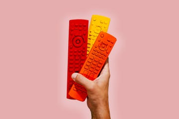 red, yellow and orange remotes on a pink background