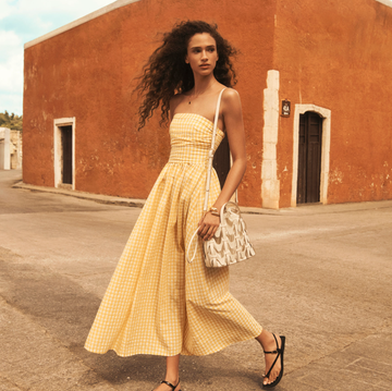 Best Summer Dresses on Amazon 2025 fashionable individual walking in a textured yellow dress on a street