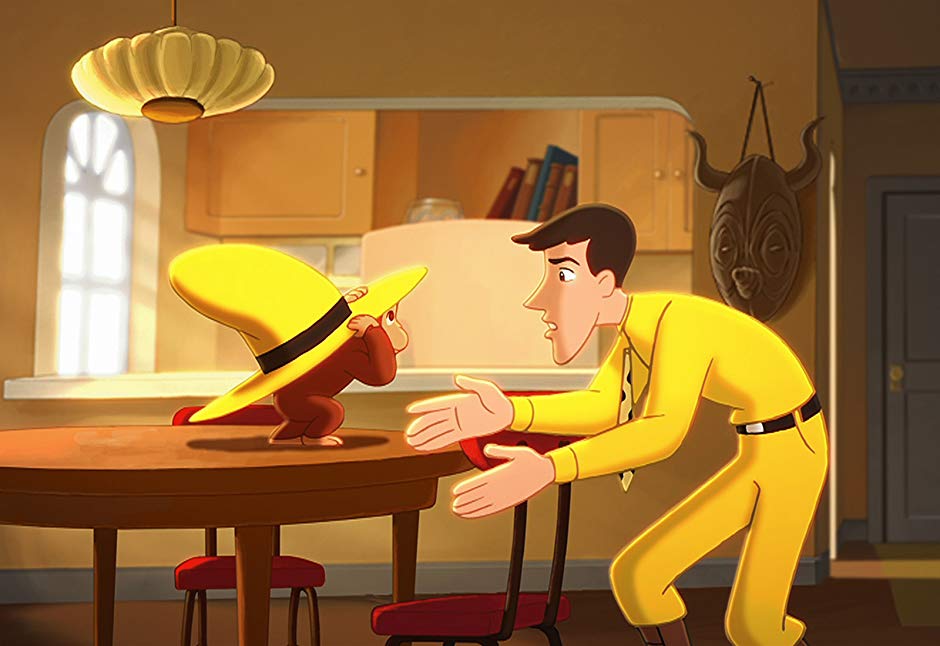 the man in the yellow hat tries to get his hat back from curious george in a scene from curious george, a good housekeeping pick for best toddler movies
