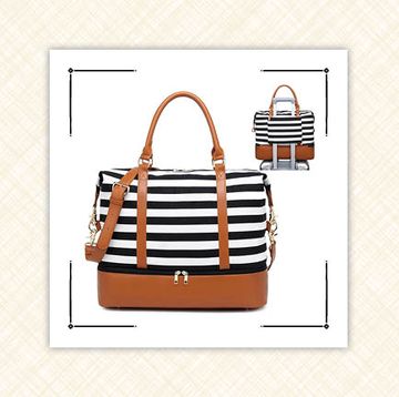 black and white striped weekender bag with trolley handle and leather accents and black blanket