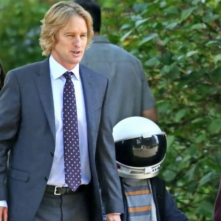 A boy with a helmet on his head walks down the street with his parents in a scene from Wonder, a Good Housekeeping pick for best tween movies a boy with a helmet on his head walks down the street with his parents in a scene from wonder, a good housekeeping pick for best tween movies