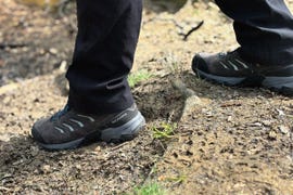 close up of a faceless person wearing a pair of scarpa hiking boots
