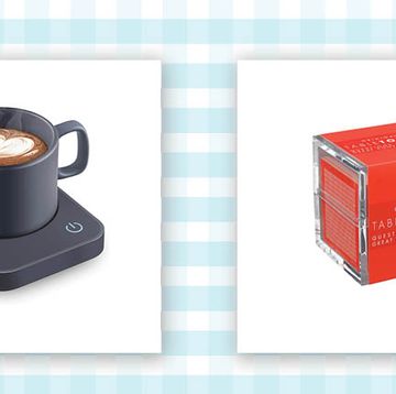 a gray electric mug warmer and a red stack of square cards called table topics all on a blue and white gingham background