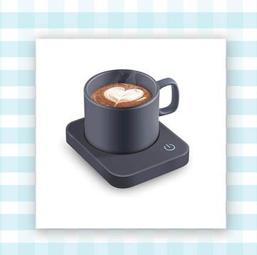 a gray electric mug warmer and a red stack of square cards called table topics all on a blue and white gingham background