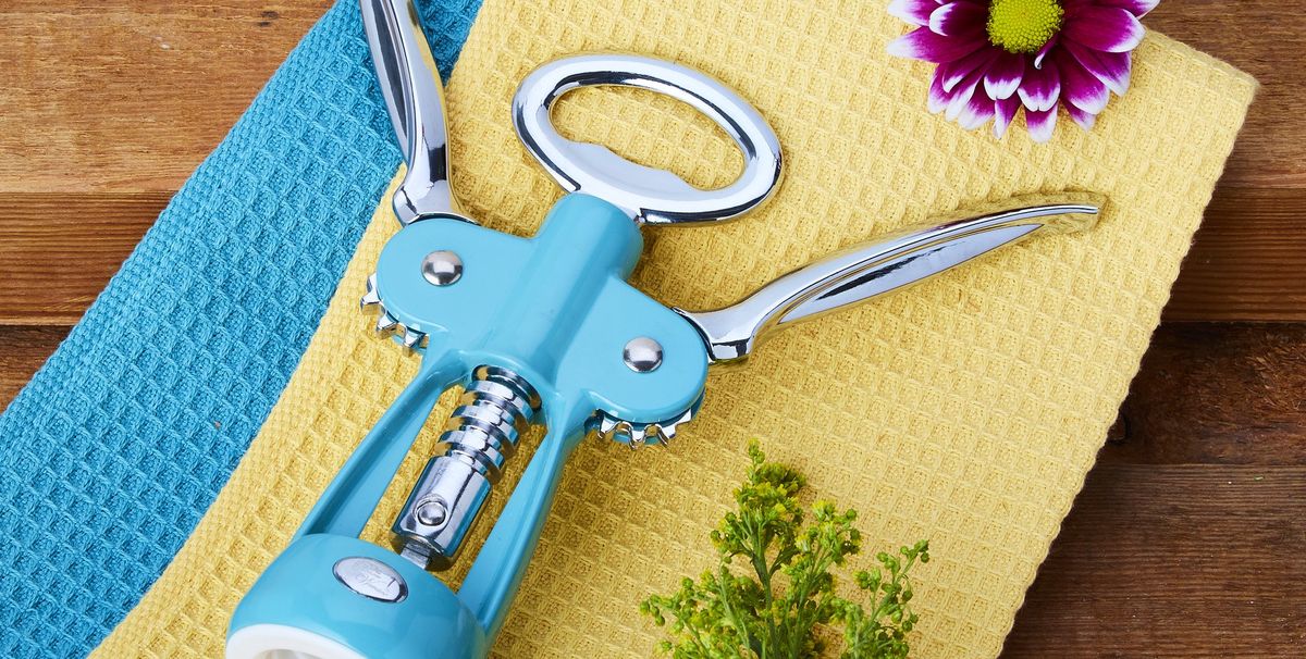 teal wine bottle opener on a yellow kitchen towel