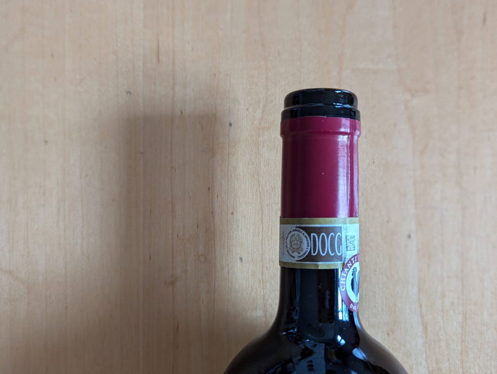 best wine openers neck of wine bottle with clean cut on foil capsule