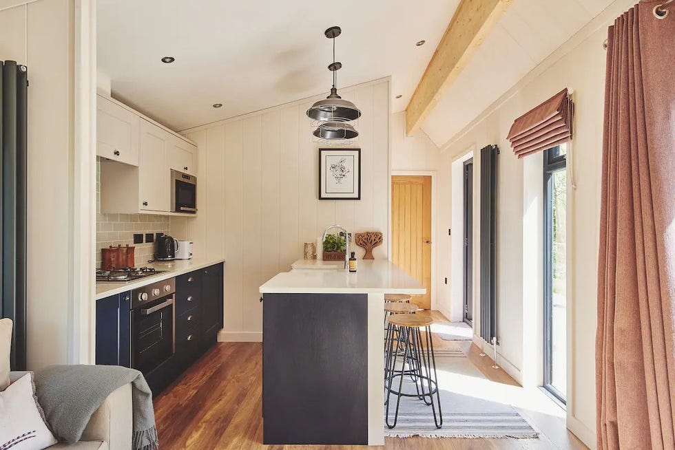 a kitchen with a bar stool