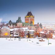 this is shot capture well known view of quebec city, which including stlawrence river, houses, and fairmont le chateau frontenac, the grand hotel this shot was taken during the dusk in winter