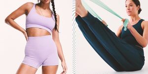 a woman in lilac sports bra and matching shorts that are ideal for hot yoga and a woman in harem pants using a yoga strap
